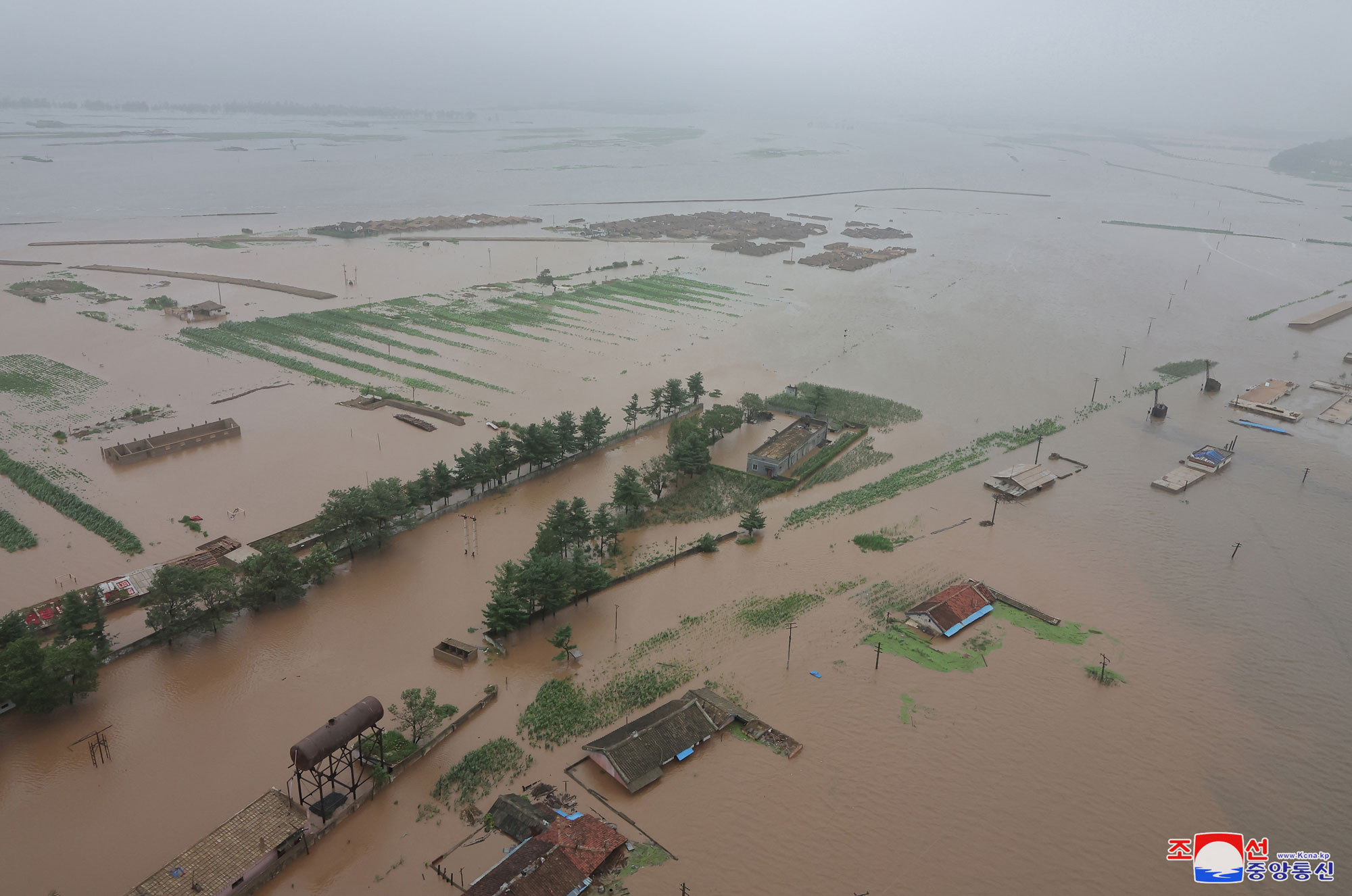 President of State Affairs <nobr><span style="font-size:110%;">Kim Jong Un</span></nobr> inspects flood-hit areas in city of Sinuiju and Uiju County of North Phyongan Province