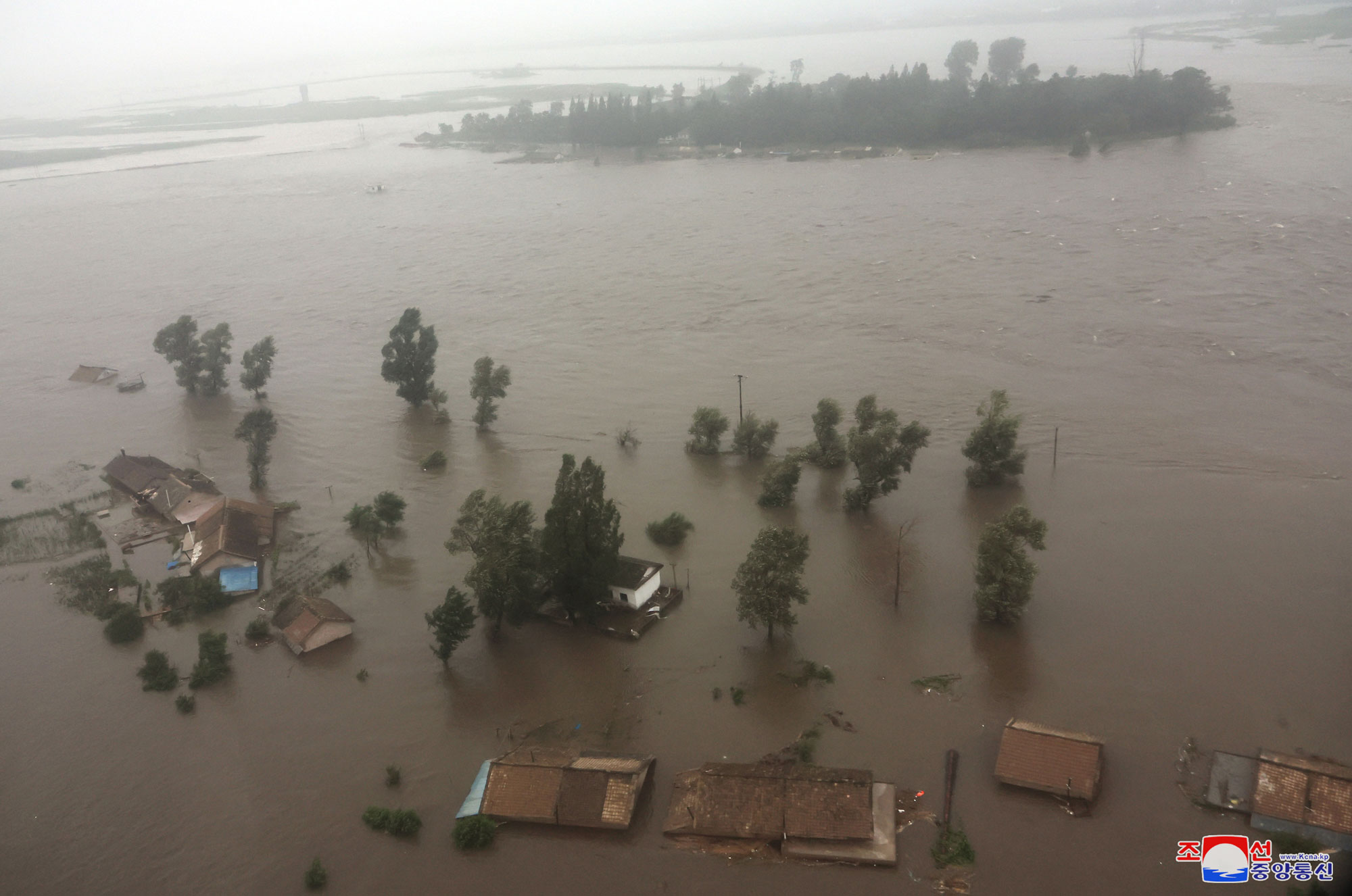 President of State Affairs <nobr><span style="font-size:110%;">Kim Jong Un</span></nobr> inspects flood-hit areas in city of Sinuiju and Uiju County of North Phyongan Province