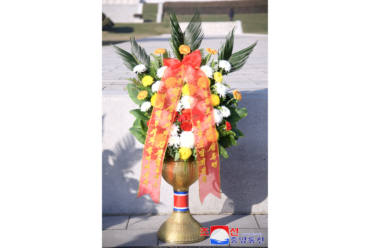 Floral baskets sent to bronze statues of great leaders Kim Il Sung and Kim Jong Il