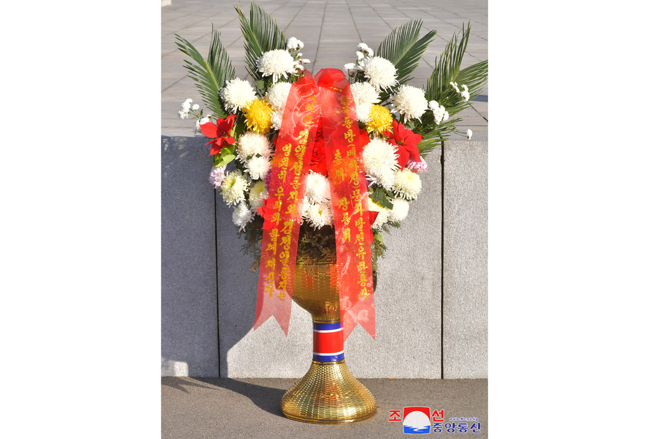 Floral baskets sent to bronze statues of great leaders Kim Il Sung and Kim Jong Il