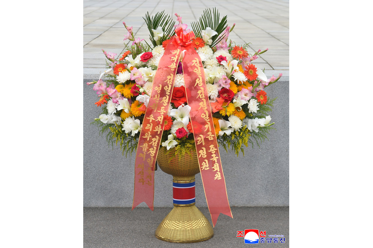 Floral baskets sent to bronze statues of great leaders Kim Il Sung and Kim Jong Il