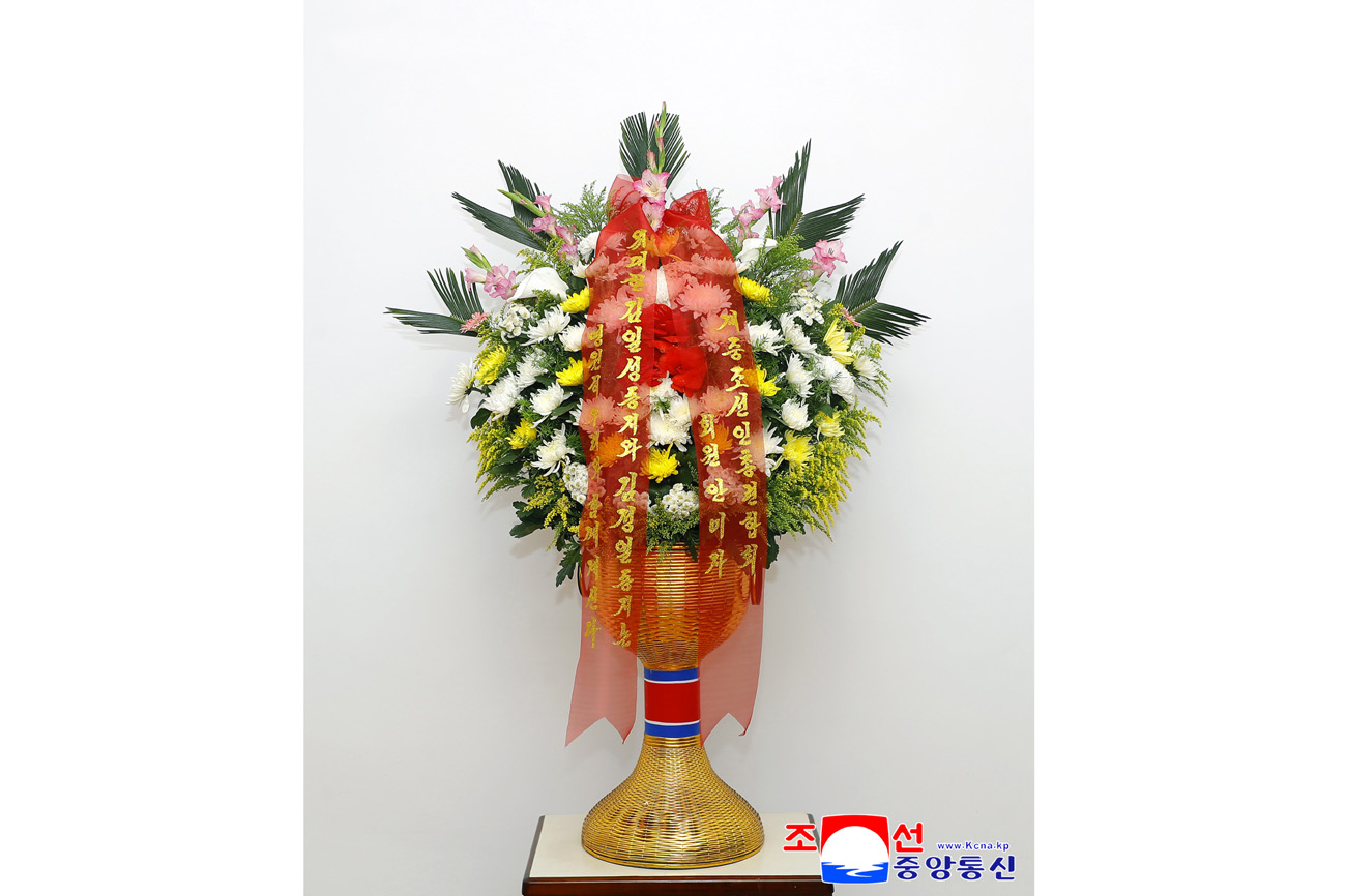 Floral baskets sent to bronze statues of great leaders Kim Il Sung and Kim Jong Il