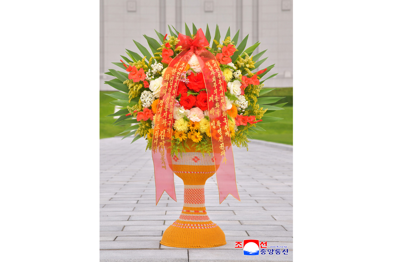 Floral baskets laid at bronze statues of great leaders Kim Il Sung and Kim Jong Il by foreign embassy staff members