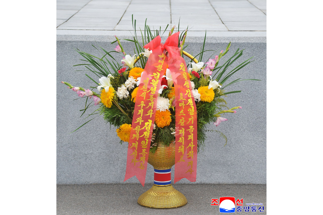 Floral baskets laid at bronze statues of great leaders Kim Il Sung and Kim Jong Il by foreign embassy staff members